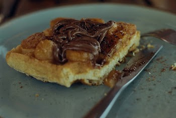 Shallow Focus Photo Of Bread With Chocolate Spreading