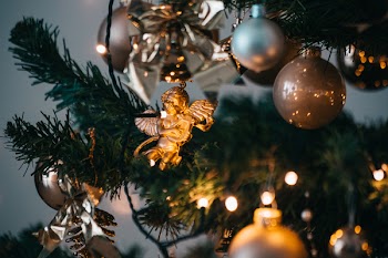 Shallow Focus Photo Of Cherub Hanged On Christmas Tree