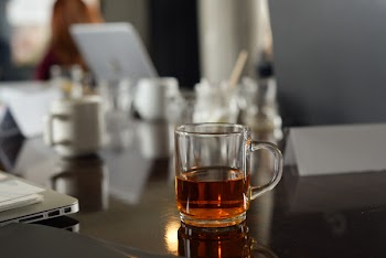Shallow Focus Photo of Clear Glass Mug