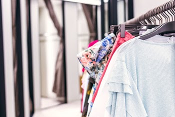 Shallow Focus Photo of Clothes Lot