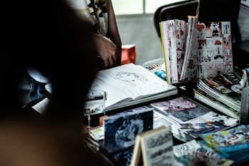 Shallow Focus Photo of Comic Books