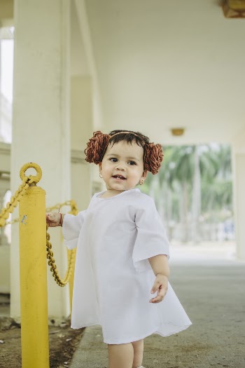Shallow Focus Photo of Girl in White Long-sleeved Dress