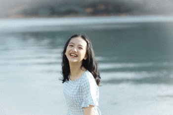 Shallow Focus Photo of Girl Smiling