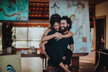 Shallow Focus Photo of Man Carrying Woman