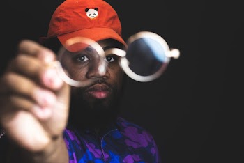 Shallow Focus Photo of Man Holding Eyeglasses