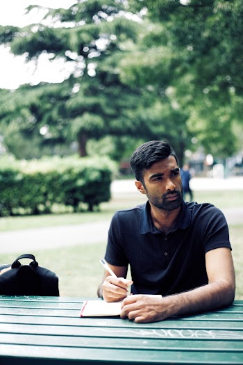 Shallow Focus Photo of Man in Black Polo Shirt