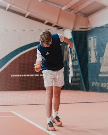 Shallow Focus Photo of Man in Blue and White Adidas T-shirt