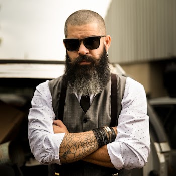 Shallow Focus Photo of Man in White and Black Polka-dot Dress Shirt Wearing Black Sunglasses