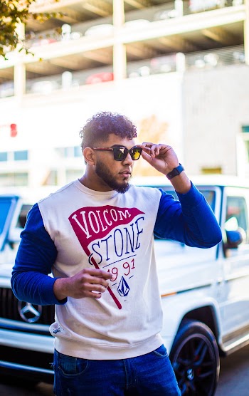 Shallow Focus Photo of Man in White and Blue Sweatshirt
