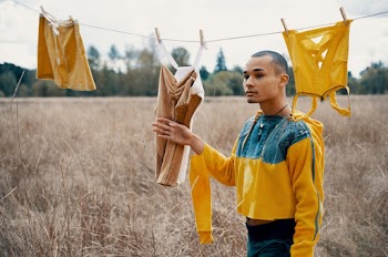 Shallow Focus Photo of Man in Yellow and Blue Long-sleeved Shirt