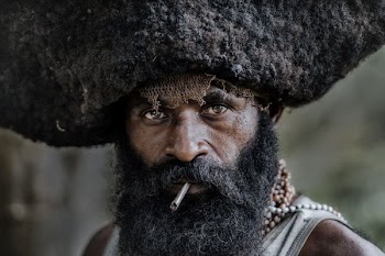 shallow focus photo of man smoking