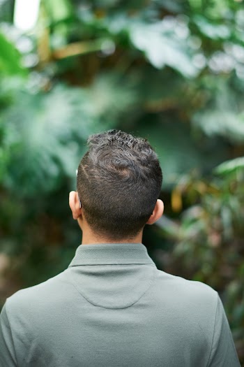 Shallow Focus Photo of Man Wearing Gray Collared Shirt
