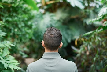 Shallow Focus Photo of Man Wearing Green Polo Shirt