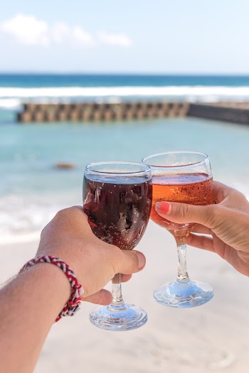 Shallow Focus Photo of Person Holding Clear Footed Wine Glass