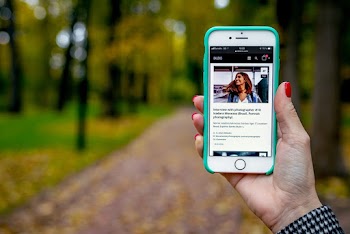 Shallow Focus Photo of Person Holding Smartphone