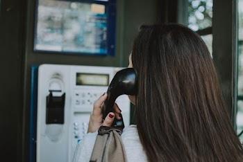 Shallow Focus Photo Of Person Using Telephone