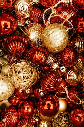 Shallow Focus Photo of Red and Gold Christmas Baubles
