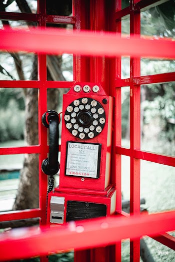 Shallow Focus Photo Of Red Rotary Telephone