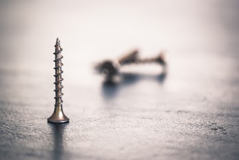 Shallow Focus Photo of Screw