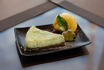 Shallow Focus Photo of Sliced Cake on Black Ceramic Tray