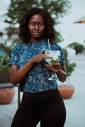 Shallow Focus Photo of Woman Holding Wine Glass