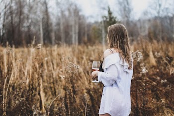Shallow Focus Photo of Woman Holding Wine Glass