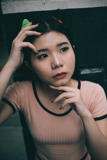 Shallow Focus Photo of Woman in Beige Crew-neck T-shirt