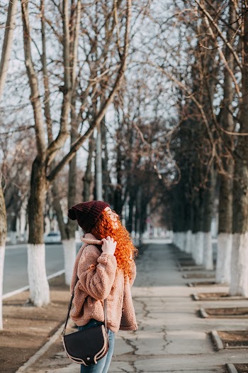 Shallow Focus Photo of Woman in Beige Jacket