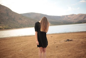 Shallow Focus Photo of Woman in Black Dress