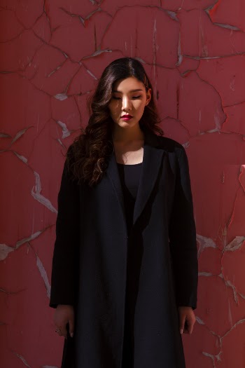 Shallow Focus Photo of Woman in Black Long-sleeved Shirt