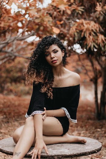 Shallow Focus Photo of Woman in Black Off-shoulder Shirt