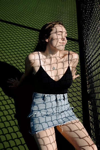 Shallow Focus Photo of Woman in Black Spaghetti Strap Top