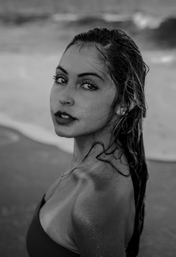 Shallow Focus Photo of Woman in Black Strapless Top