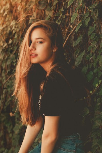 Shallow Focus Photo Of Woman In Black T-shirt