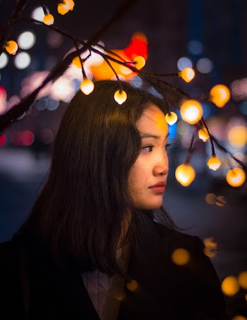 Shallow Focus Photo of Woman in Black Top
