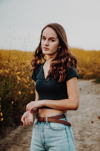 Shallow Focus Photo of Woman in Black V-neck T-shirt