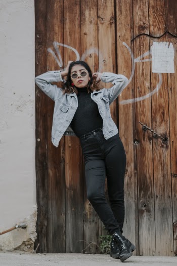 Shallow Focus Photo of Woman in Blue Denim Button-up Jacket