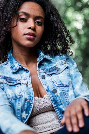 Shallow Focus Photo of Woman in Blue Denim Button-up Jacket
