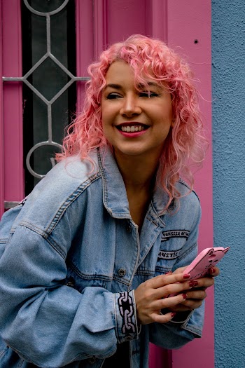 Shallow Focus Photo of Woman in Blue Denim Button-up Jacket