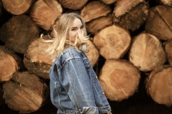 Shallow Focus Photo of Woman in Blue Denim Jacket