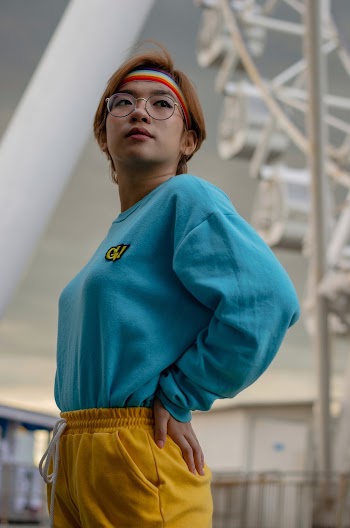 Shallow Focus Photo of Woman in Blue Gnarly Brand Crew-neck Long-sleeved Shirt