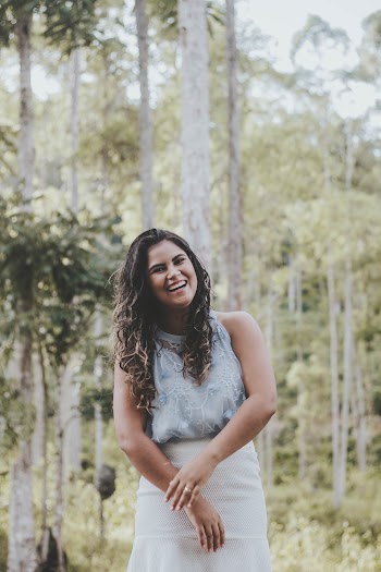 Shallow Focus Photo of Woman in Gray Sleeveless Dress