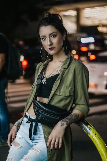 Shallow Focus Photo of Woman in Green Button-up Shirt