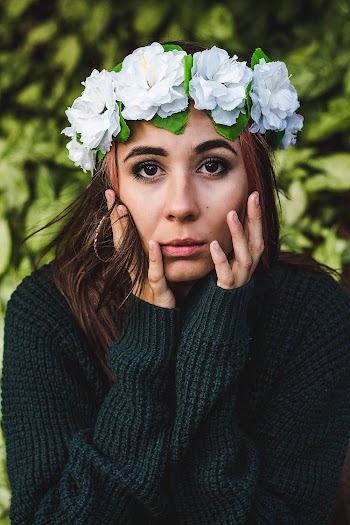 Shallow Focus Photo Of Woman In Green Sweater
