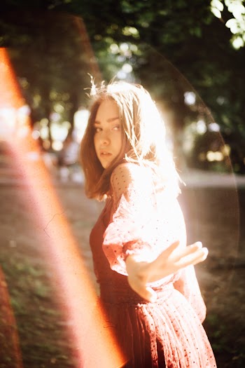 Shallow Focus Photo of Woman in Long-sleeved Dress