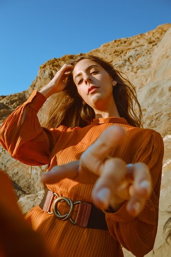 Shallow Focus Photo Of Woman In Long Sleeved Dress