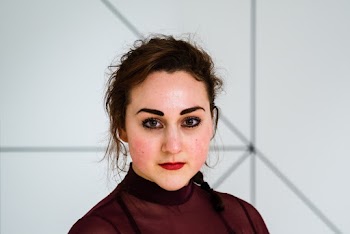 Shallow Focus Photo of Woman in Maroon Turtleneck Shirt