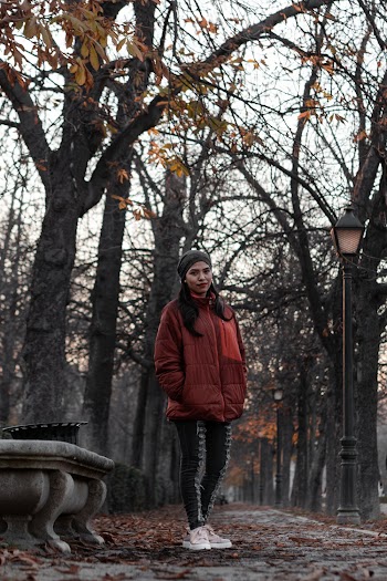 Shallow Focus Photo Of Woman In Red Full-zip Jacket