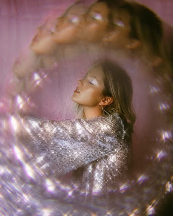 Shallow Focus Photo of Woman in Silver Top