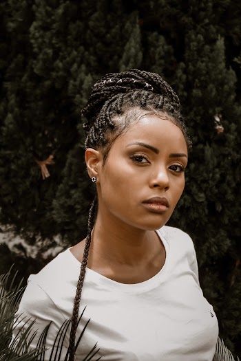 Shallow Focus Photo of Woman in White Crew-neck Shirt